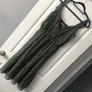 Green dress with black and white dots